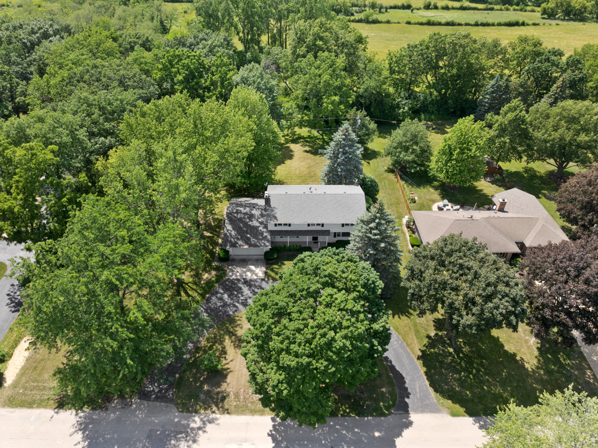 690 Stanford Drive Marengo, IL 60152 - Photo 29 of 30 a view of a garden with a plants and trees