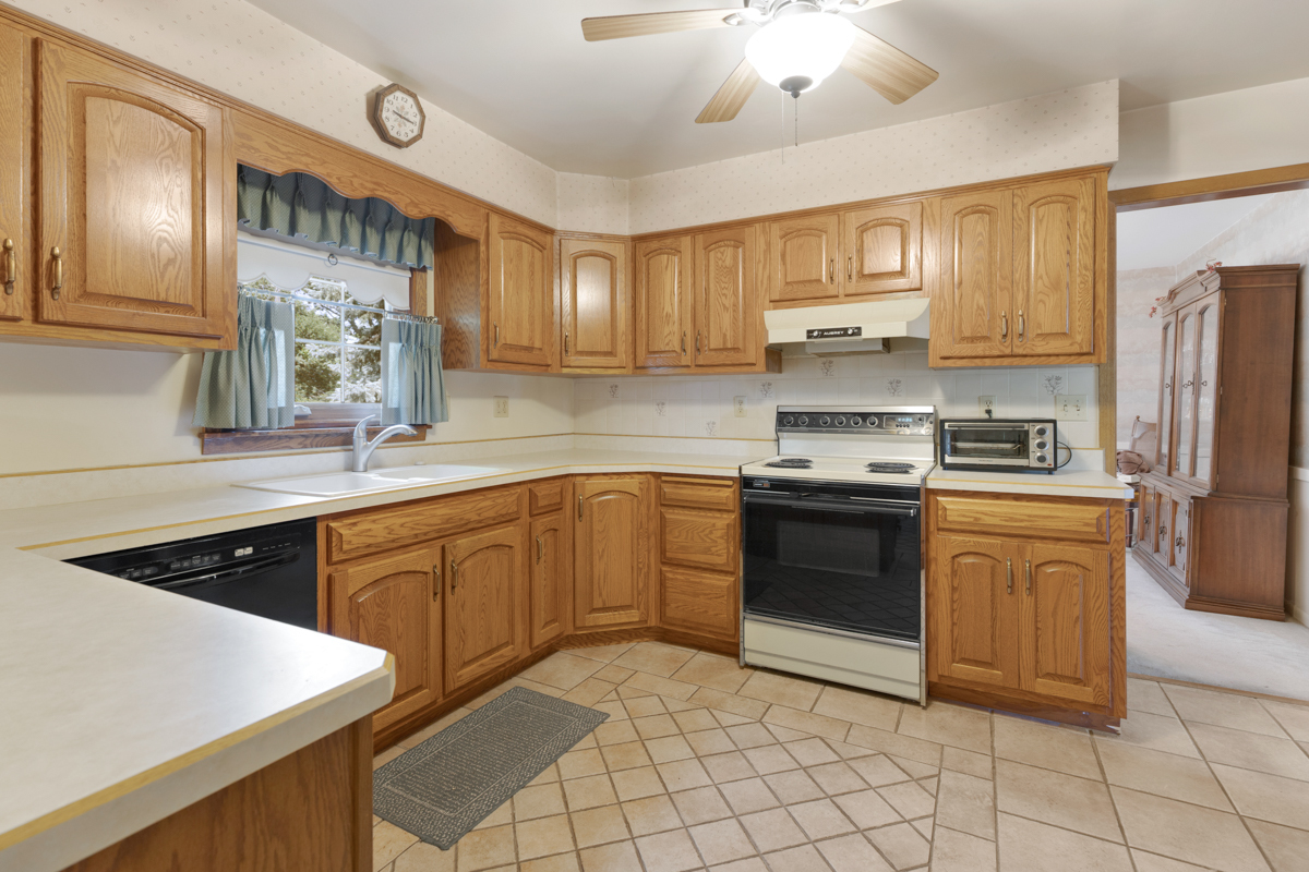 690 Stanford Drive Marengo, IL 60152 - Photo 10 of 30 a kitchen with stainless steel appliances granite countertop a sink and cabinets