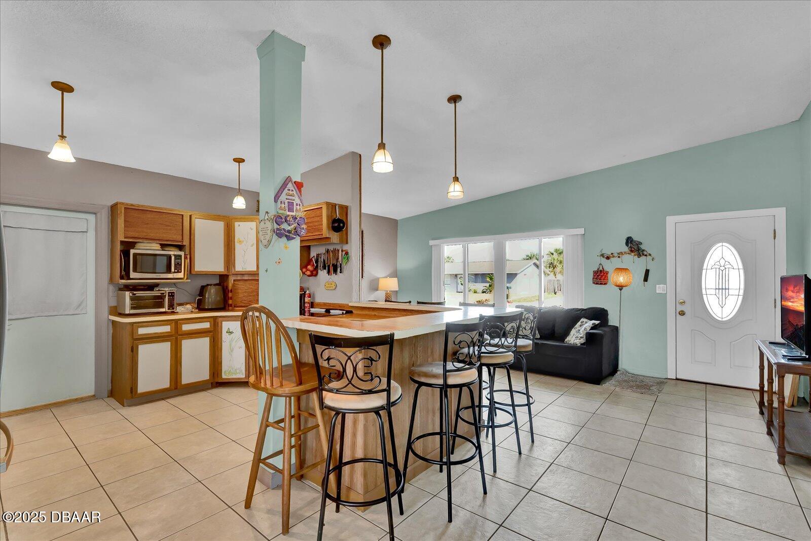 34 Dolphin Avenue Ormond Beach, FL 32176 - Photo 11 of 52 a very nice looking open dining room with kitchen island furniture