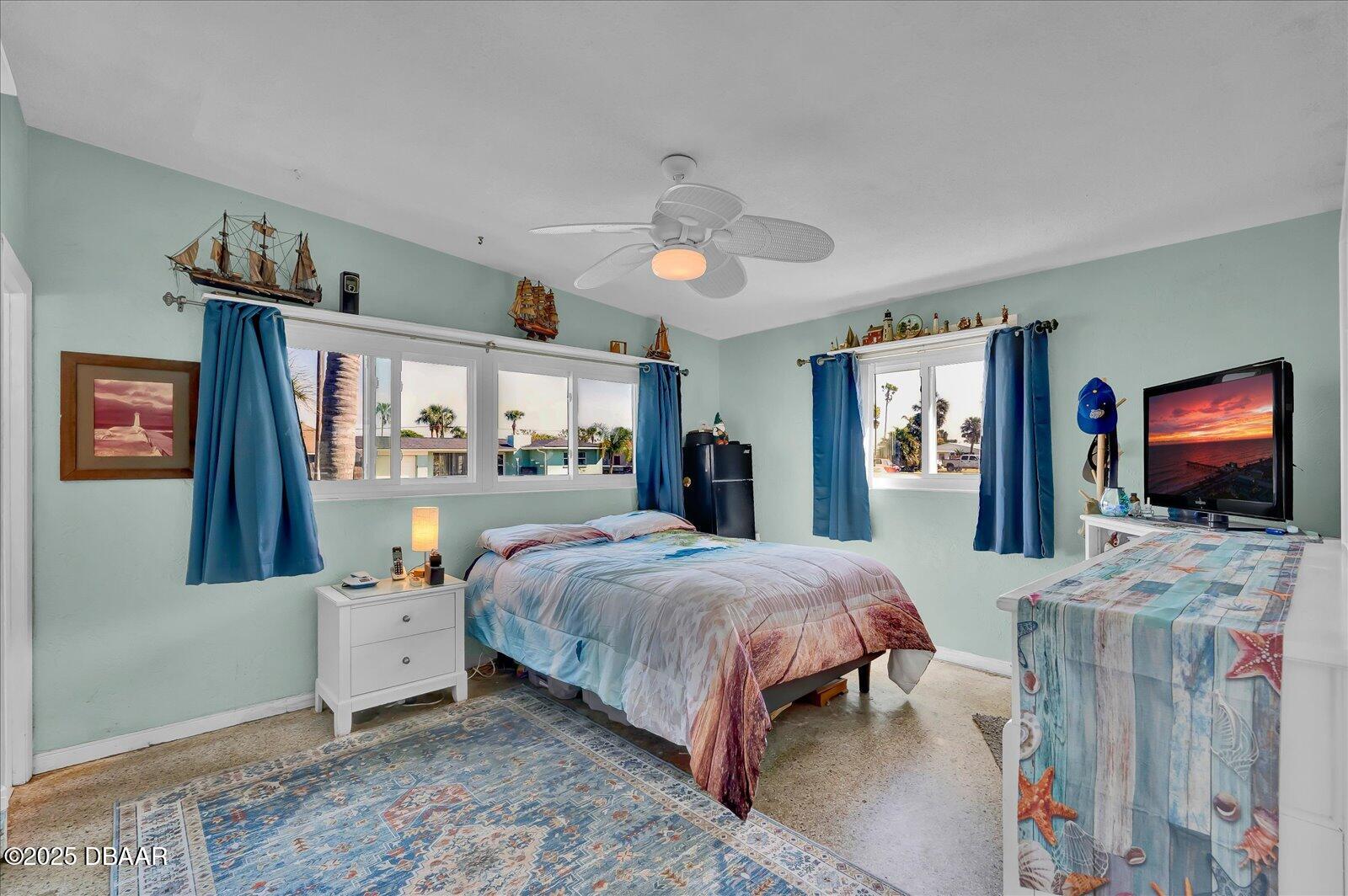 34 Dolphin Avenue Ormond Beach, FL 32176 - Photo 17 of 52 a bedroom with a bed and a flat screen tv
