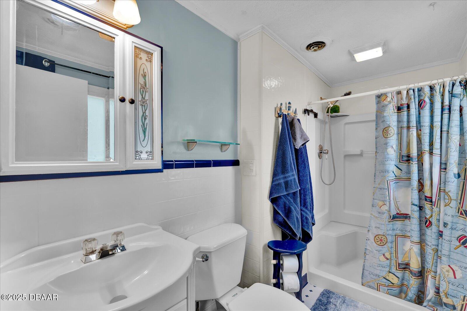34 Dolphin Avenue Ormond Beach, FL 32176 - Photo 19 of 52 a bathroom with a sink and a toilet