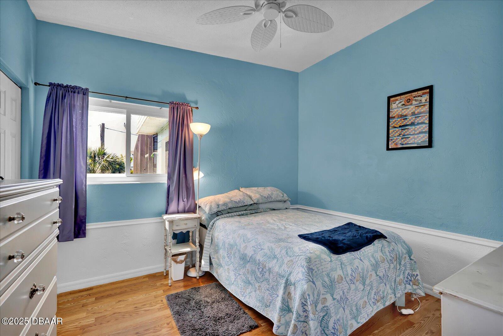34 Dolphin Avenue Ormond Beach, FL 32176 - Photo 21 of 52 a bed sitting in a bedroom next to a window