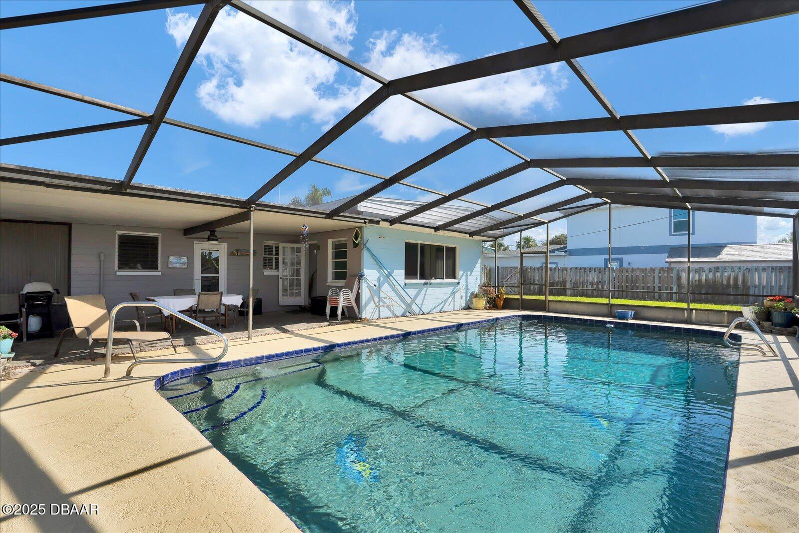 34 Dolphin Avenue Ormond Beach, FL 32176 - Photo 30 of 52 a view of swimming pool with outdoor seating