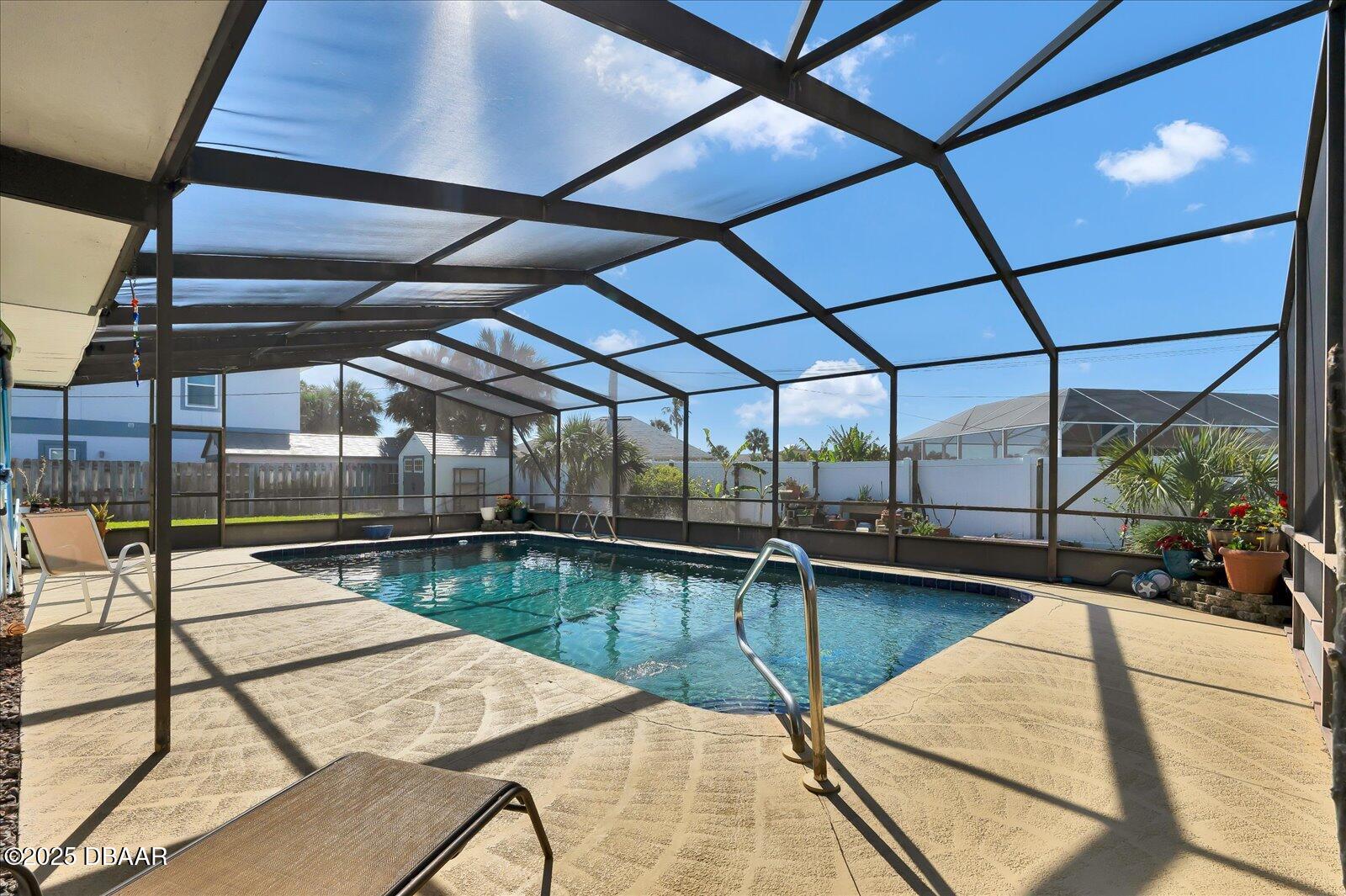 34 Dolphin Avenue Ormond Beach, FL 32176 - Photo 3 of 52 a view of a swimming pool with a patio