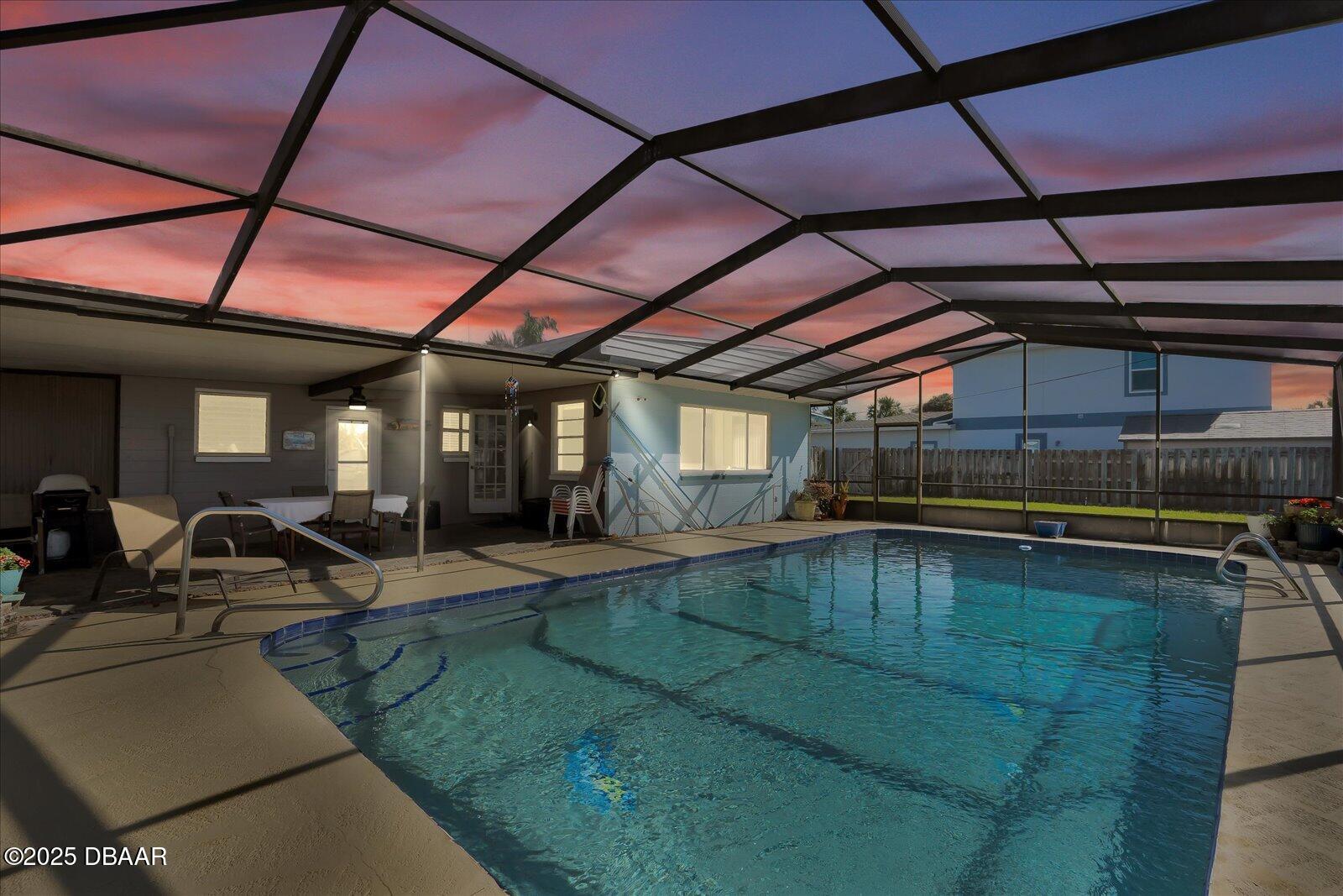 34 Dolphin Avenue Ormond Beach, FL 32176 - Photo 31 of 52 a view of a swimming pool with a patio