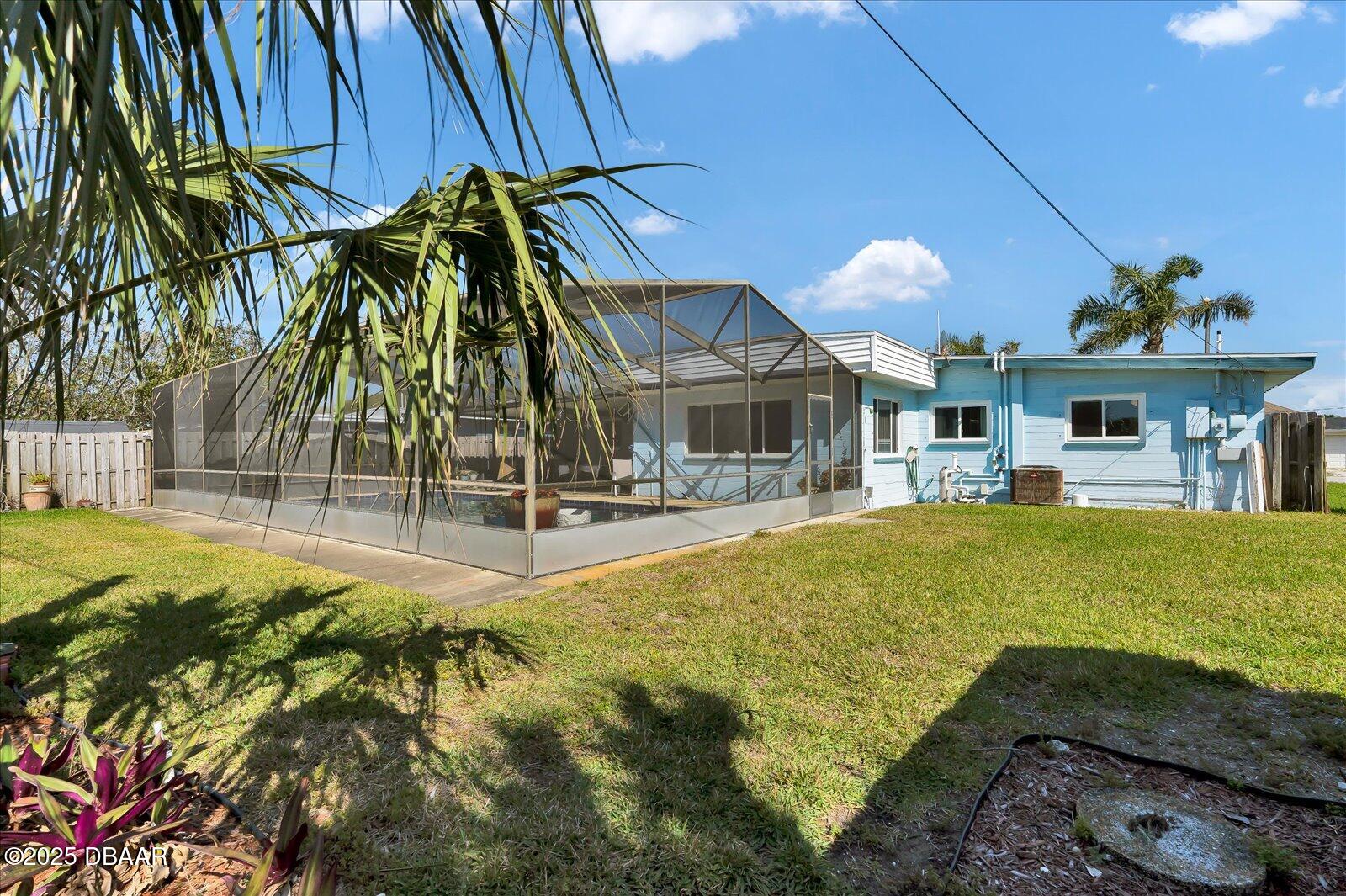 34 Dolphin Avenue Ormond Beach, FL 32176 - Photo 39 of 52 a swimming pool with outdoor seating and yard