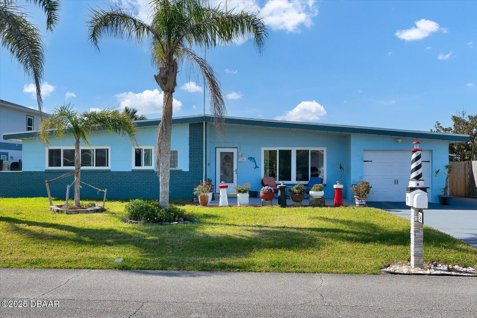 34 Dolphin Avenue Ormond Beach, FL 32176 - Photo 45 of 52 a view of a house with backyard and sitting area