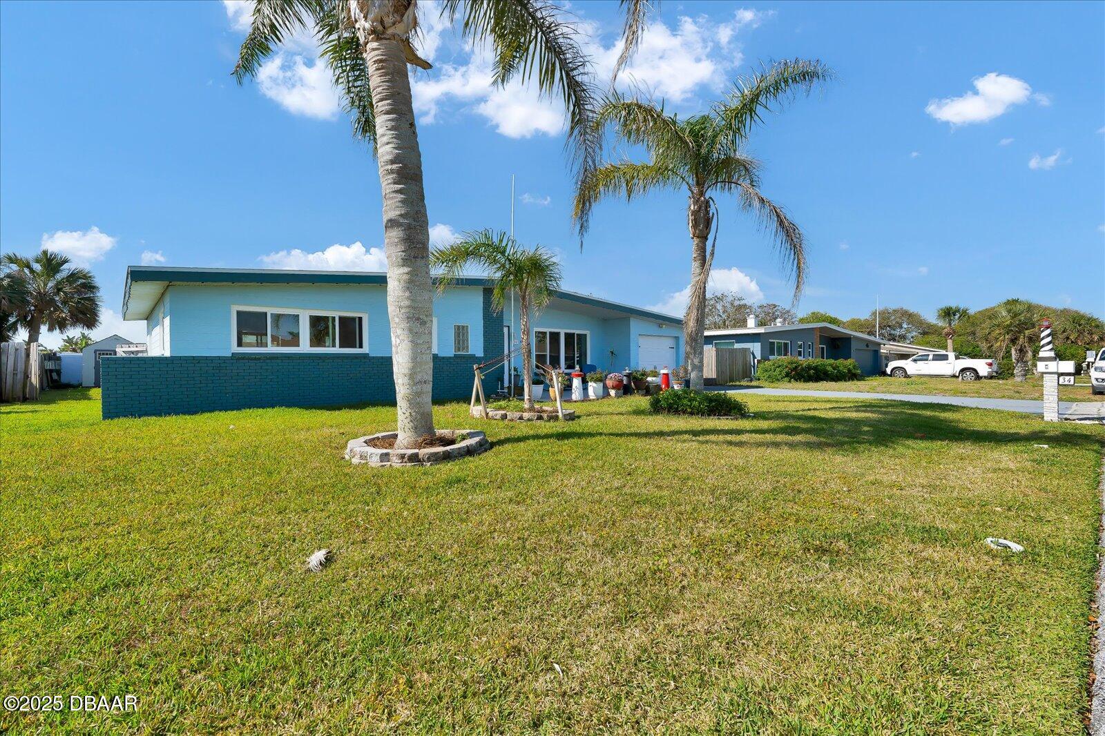 34 Dolphin Avenue Ormond Beach, FL 32176 - Photo 48 of 52 a view of a house with swimming pool yard and patio