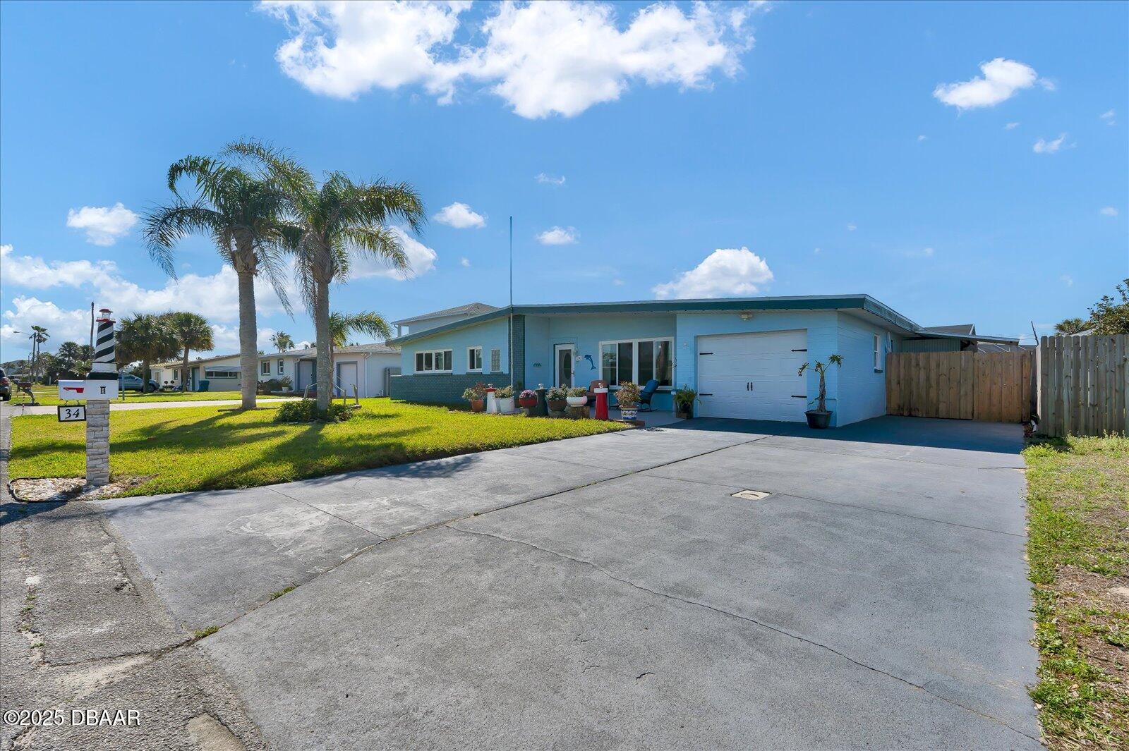 34 Dolphin Avenue Ormond Beach, FL 32176 - Photo 50 of 52 a view of a house with swimming pool and a yard