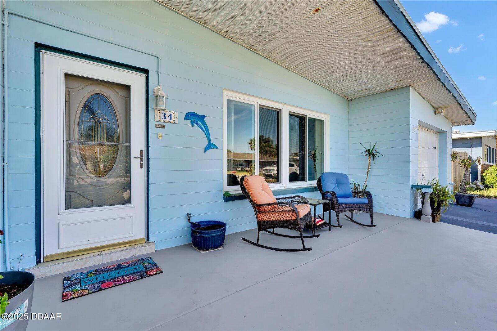 34 Dolphin Avenue Ormond Beach, FL 32176 - Photo 52 of 52 a outdoor living space with furniture and a fireplace