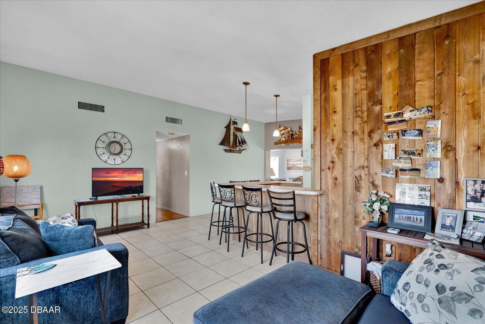 34 Dolphin Avenue Ormond Beach, FL 32176 - Photo 7 of 52 a living room with furniture and wooden floor