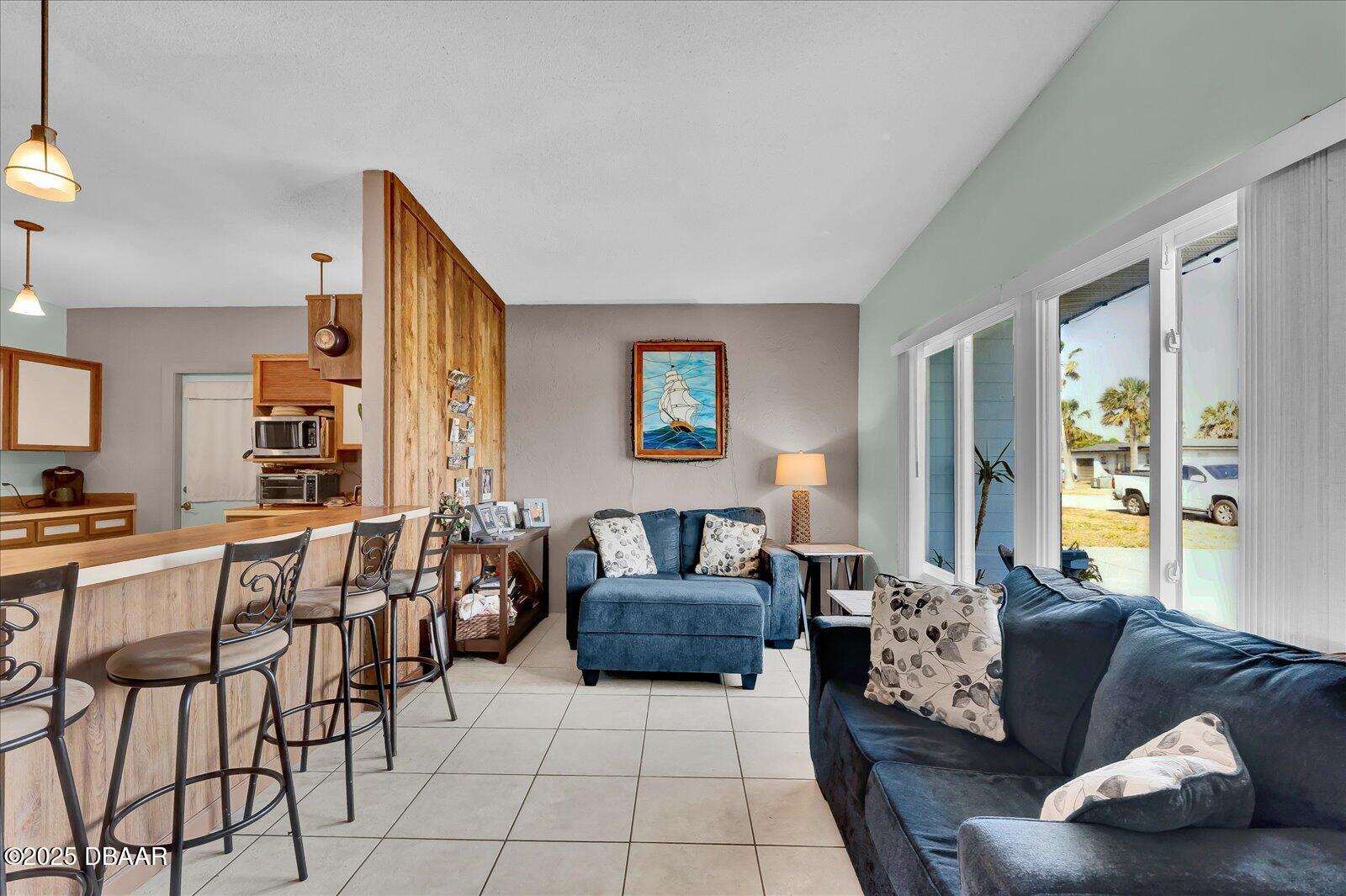 34 Dolphin Avenue Ormond Beach, FL 32176 - Photo 10 of 52 a living room with furniture and wooden floor