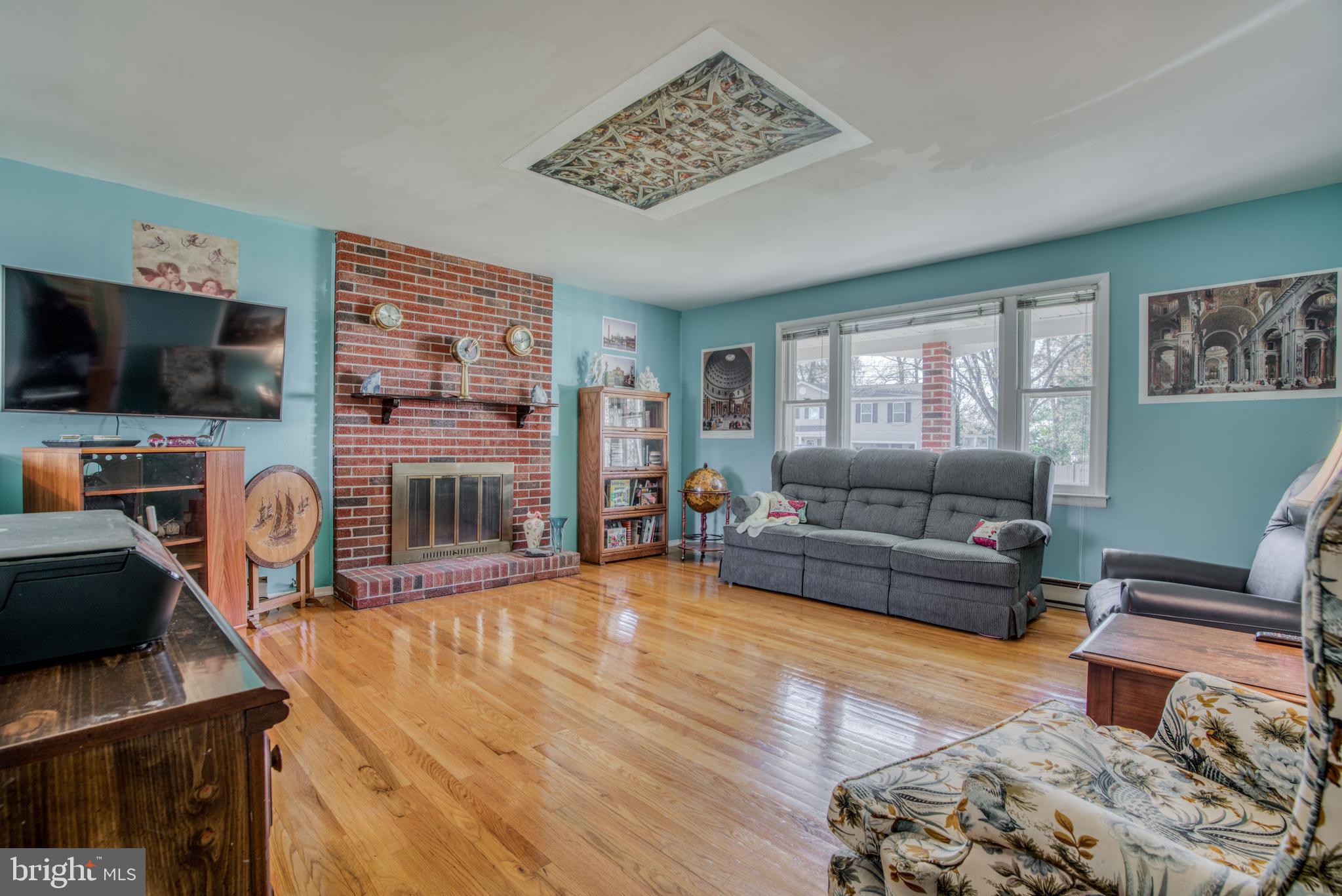 1503 Pattison Road Baltimore, MD 21221 - Photo 5 of 26 LIV RM w/FIREPLACE, HDWD, LARGE BRIGHT BAY WINDOW