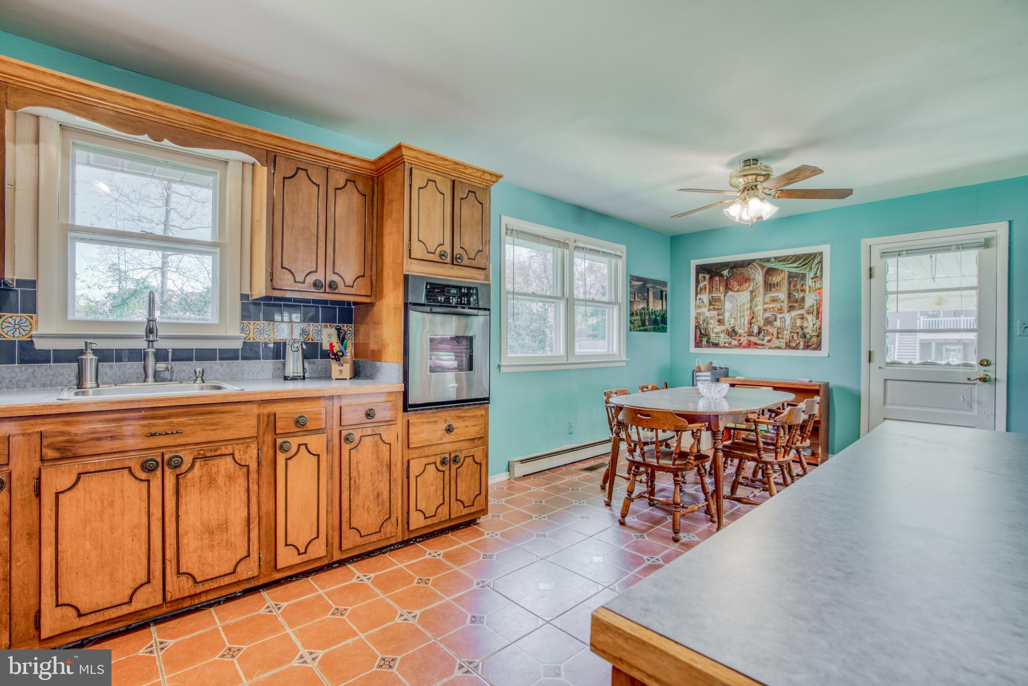 1503 Pattison Road Baltimore, MD 21221 - Photo 9 of 26 OPEN KITCHEN/DINING AREA w/ DOOR TO CARPORT