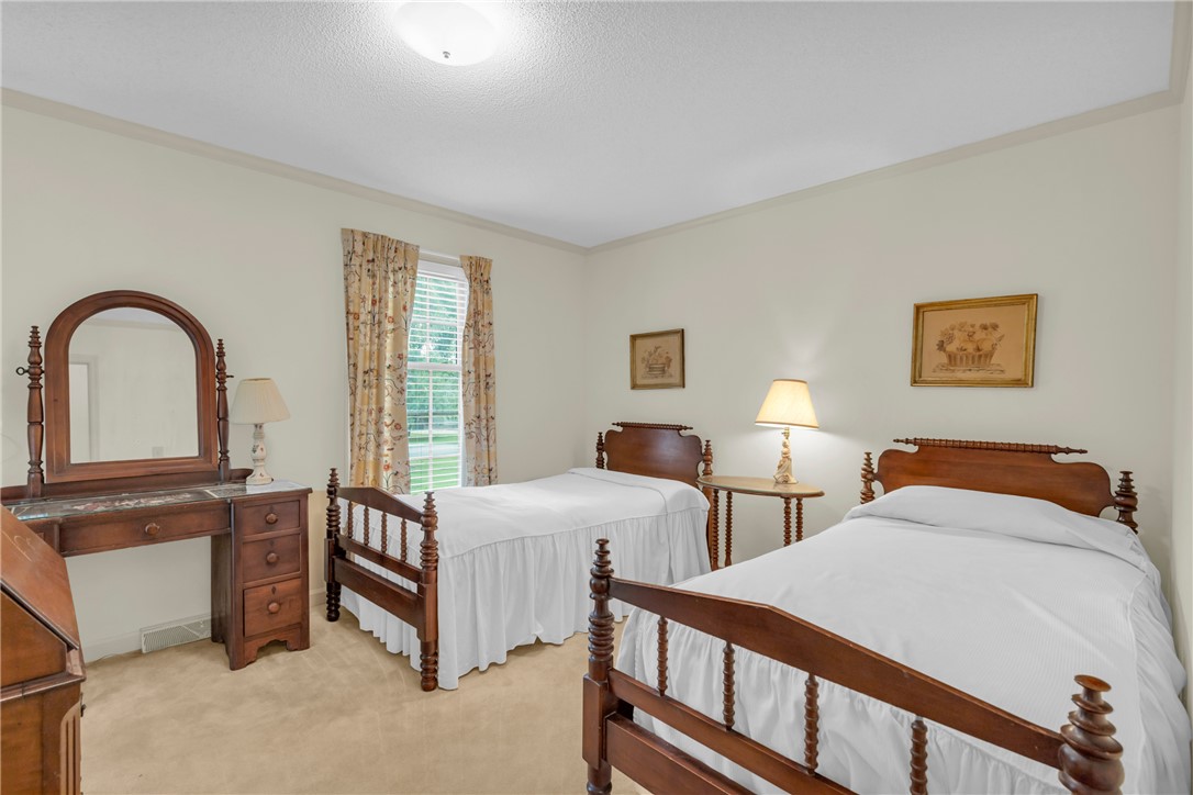 203 Fox Creek Road Anderson, SC 29621 - Photo 18 of 36 This tranquil bedroom offers soft lighting and ample space for restful rejuvenation.