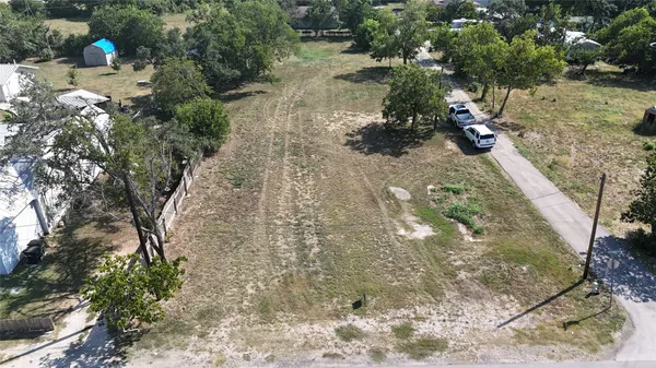 a view of a backyard of the house