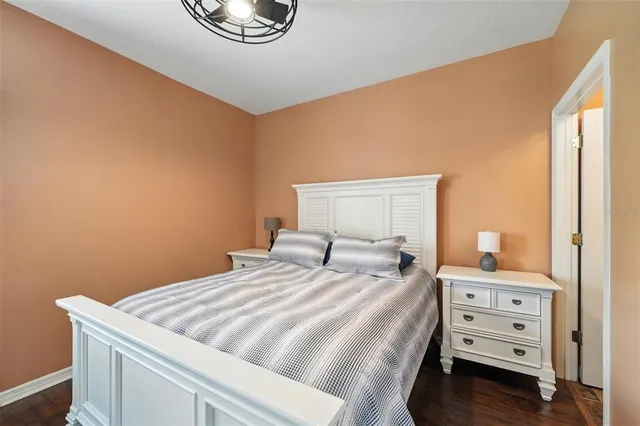 a bedroom with a bed and a dresser