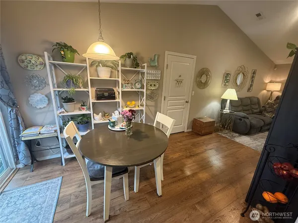 a dining room with furniture and chandelier
