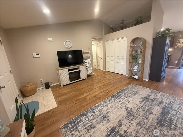 a view of a livingroom with furniture and a flat screen tv