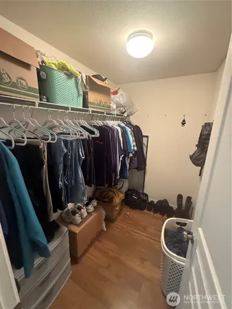 a room with gym equipment and toilet