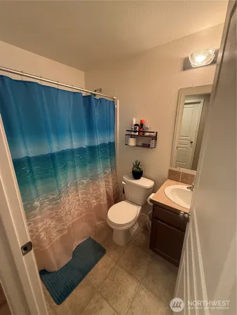 a bathroom with a sink toilet and tub