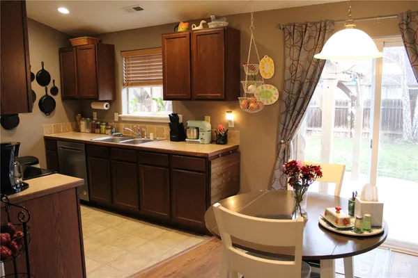 a kitchen with a sink and cabinets