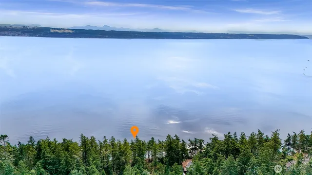 a view of a lake and a yard