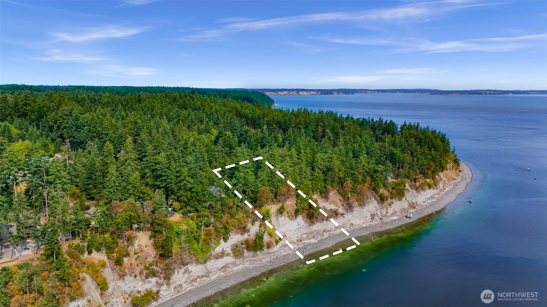 179 South Harrington Road Coupeville, WA 98239 - Photo 10 of 19 a view of a garden with a building in the background