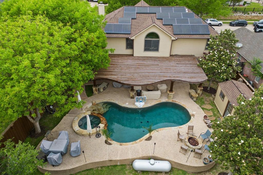 1088 Pondview Drive Cedar Hill, TX 75104 - Photo 1 of 1 View of swimming pool with a fenced backyard, an outdoor fire pit, a pool with connected hot tub, and a patio area