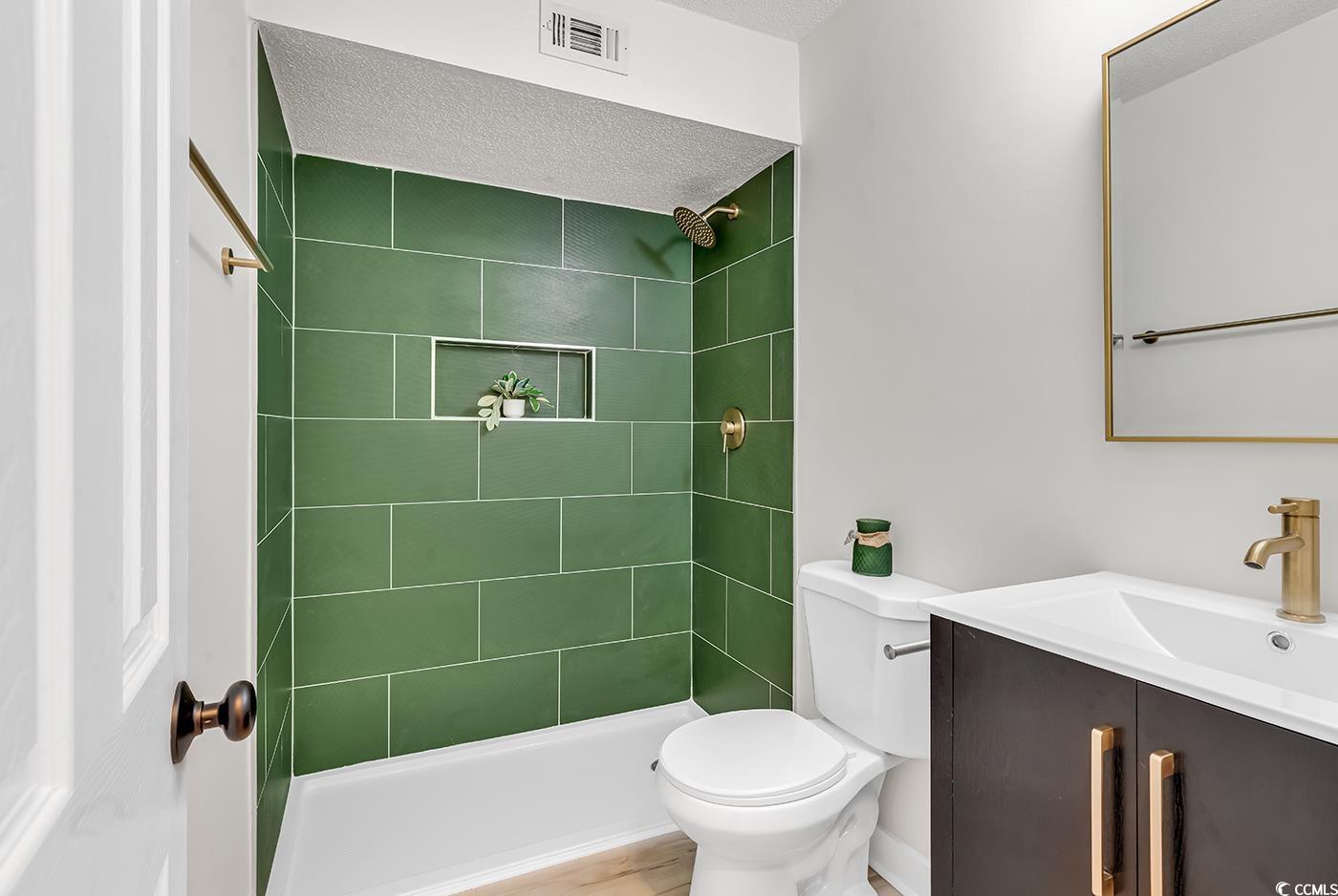 400 Cambridge Circle, Unit L7 Murrells Inlet, SC 29576 - Photo 19 of 36 Bathroom featuring toilet, vanity, a tile shower,
