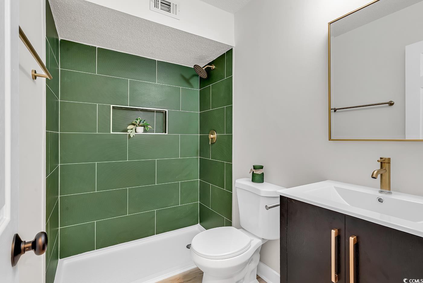 400 Cambridge Circle, Unit L7 Murrells Inlet, SC 29576 - Photo 20 of 36 Full bathroom with toilet, vanity, a tile shower,