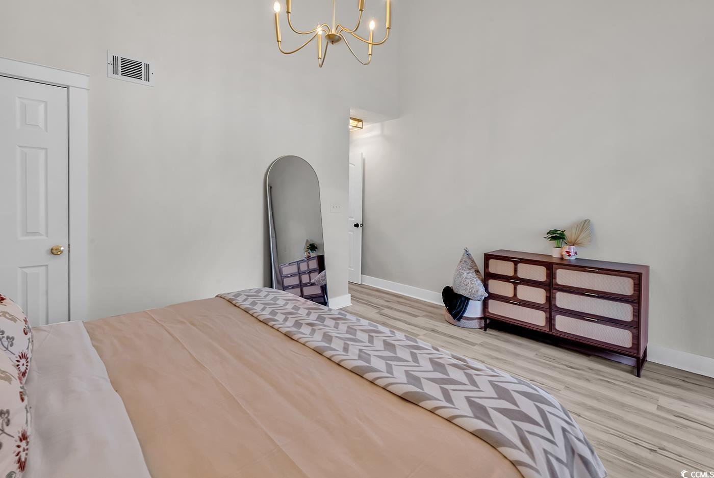 400 Cambridge Circle, Unit L7 Murrells Inlet, SC 29576 - Photo 23 of 36 Bedroom featuring baseboards, visible vents, wood
