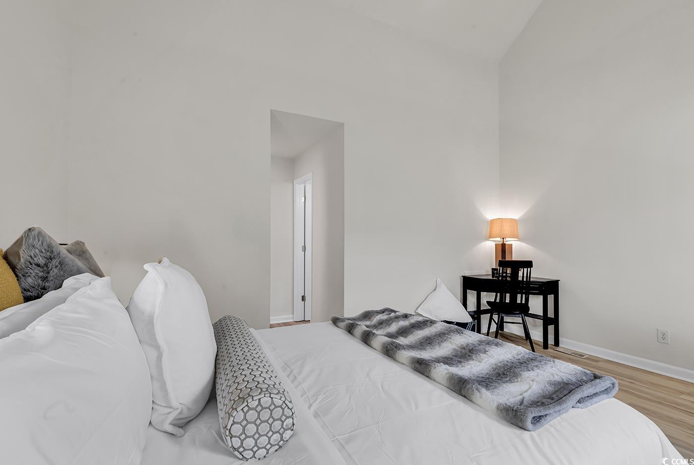 400 Cambridge Circle, Unit L7 Murrells Inlet, SC 29576 - Photo 28 of 36 Bedroom with baseboards, vaulted ceiling, and wood