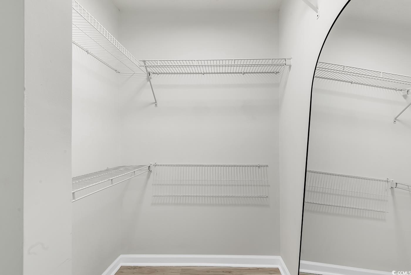 400 Cambridge Circle, Unit L7 Murrells Inlet, SC 29576 - Photo 31 of 36 Walk in closet with wood finished floors