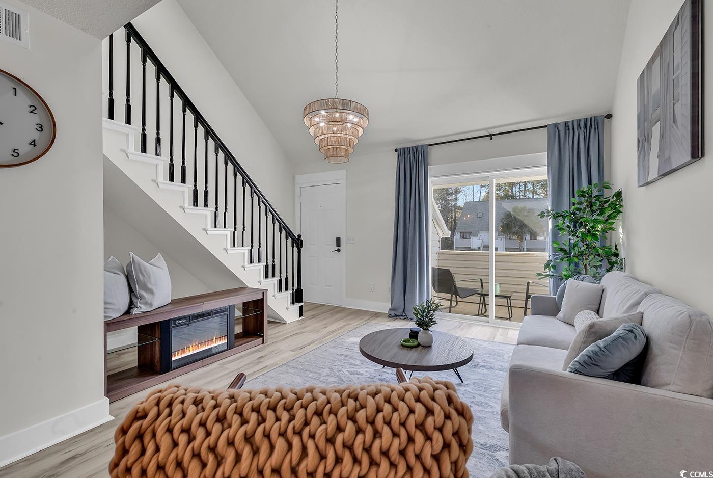 400 Cambridge Circle, Unit L7 Murrells Inlet, SC 29576 - Photo 7 of 36 Living room featuring stairway, baseboards, a chan