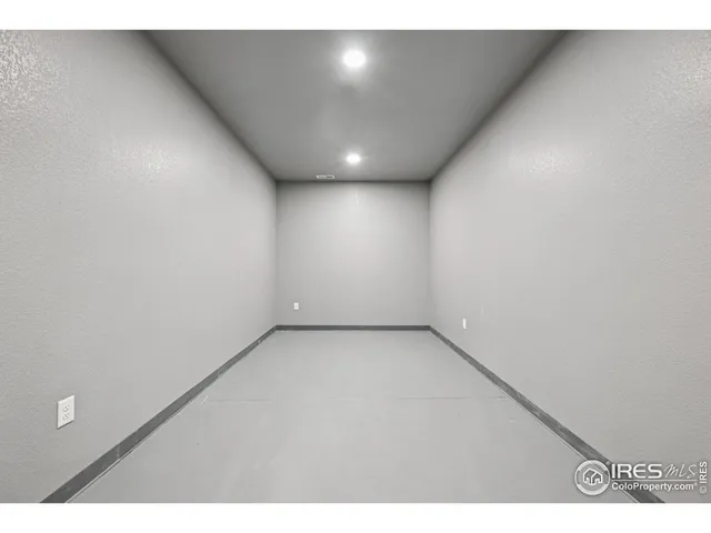 a front view of a house with a garden and yard