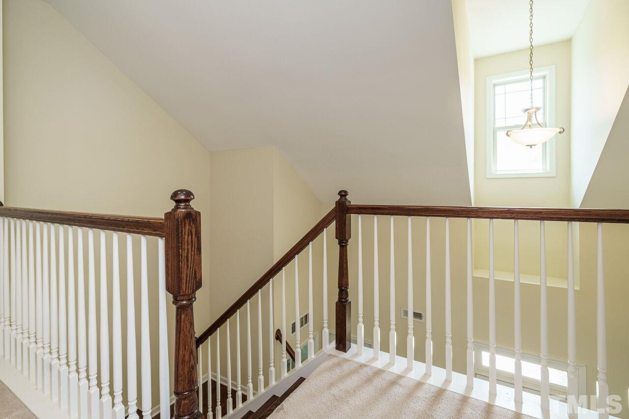 1568 Rodessa Run Raleigh, NC 27607 - Photo 19 of 25 a view of a hallway with a window