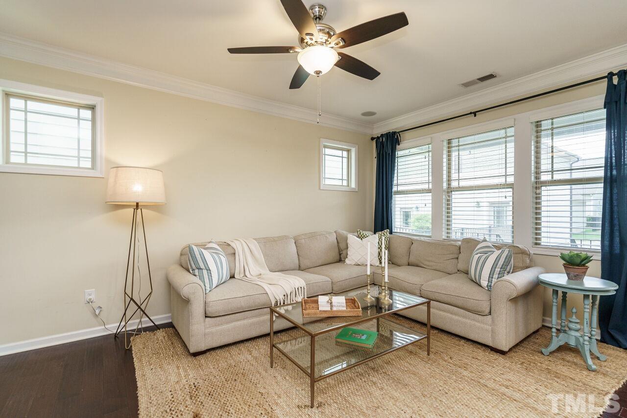 1568 Rodessa Run Raleigh, NC 27607 - Photo 4 of 25 a living room with furniture and a large window