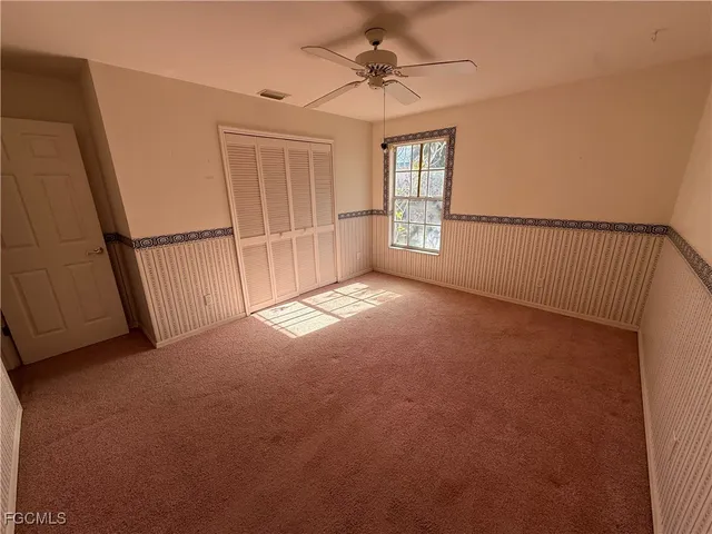 a view of empty room with windows