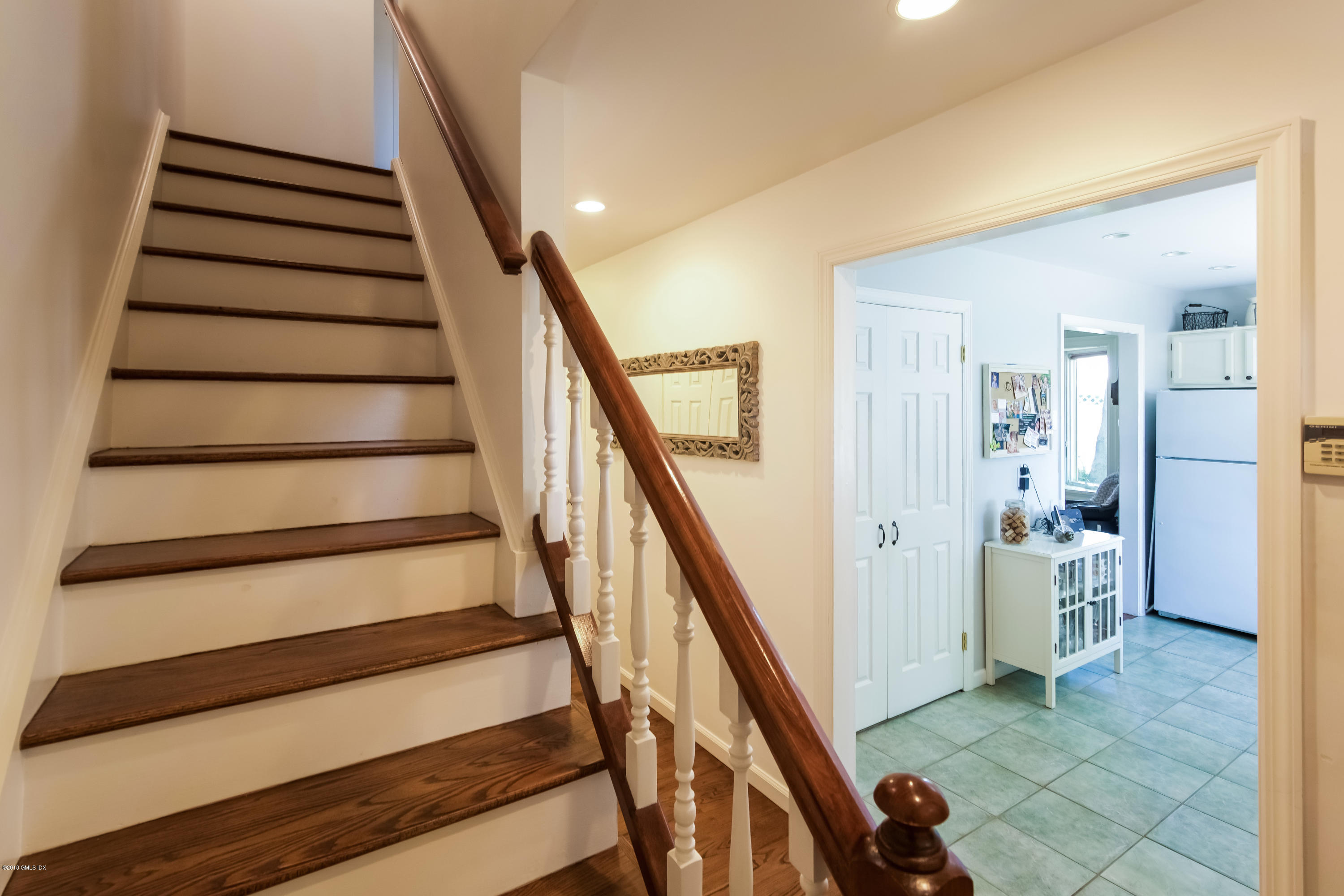22 Livingston Place, Unit D Greenwich, CT 06830 - Photo 2 of 17 a view of entryway with bedroom and stairs