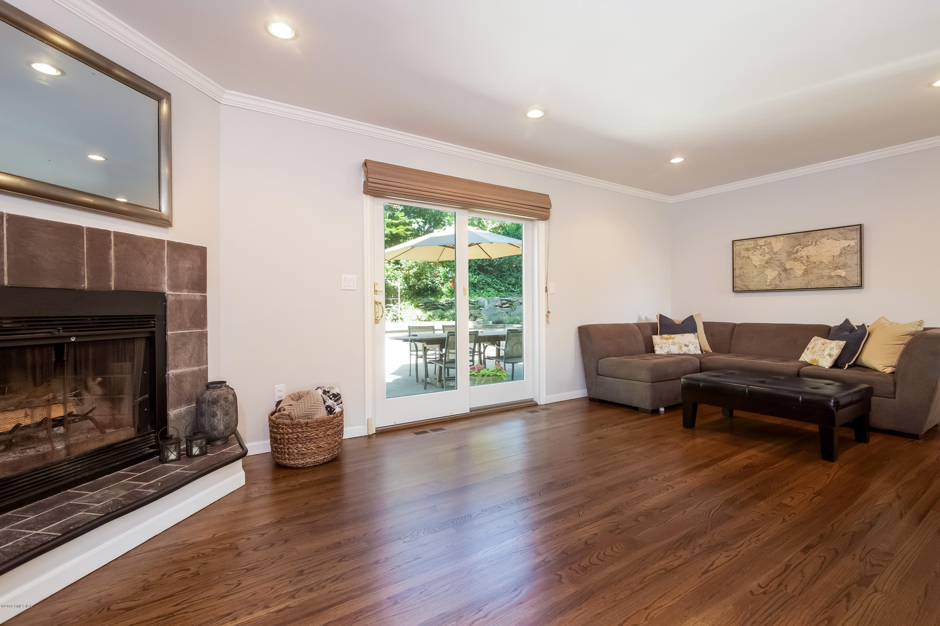 22 Livingston Place, Unit D Greenwich, CT 06830 - Photo 3 of 17 a living room with furniture and a fireplace