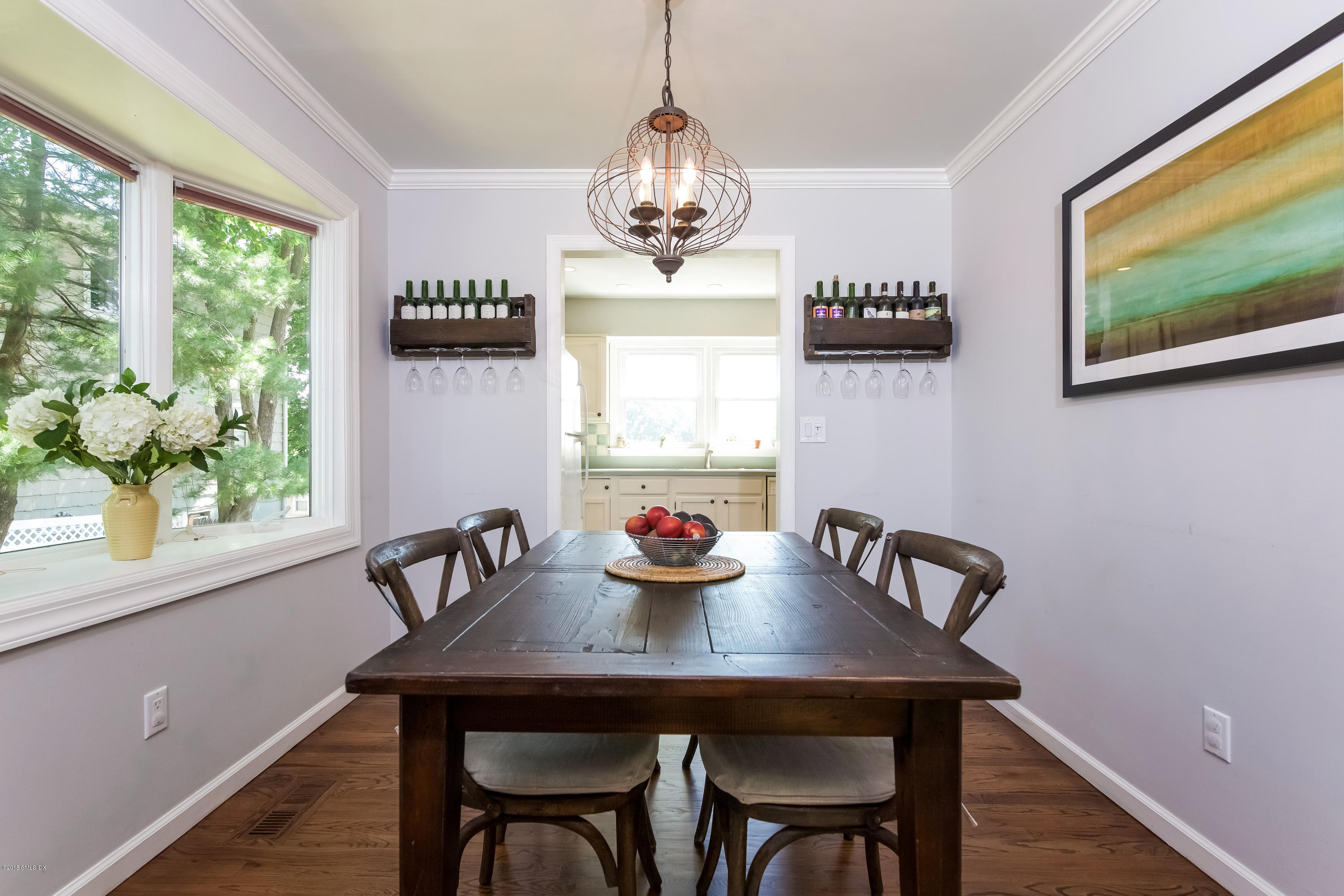 22 Livingston Place, Unit D Greenwich, CT 06830 - Photo 4 of 17 a view of a dining room with furniture window and wooden floor