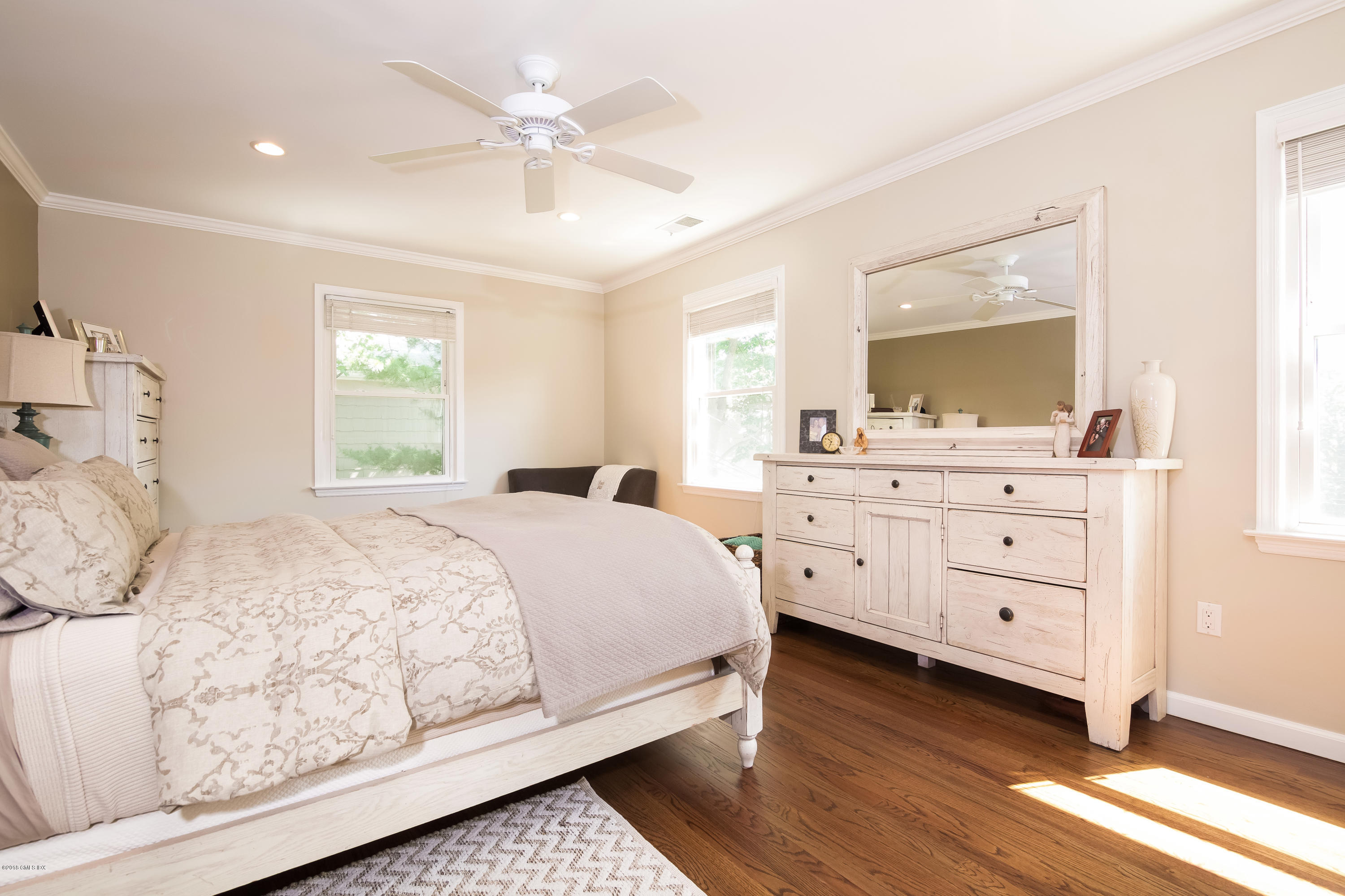 22 Livingston Place, Unit D Greenwich, CT 06830 - Photo 9 of 17 a bedroom with a large bed and a dresser
