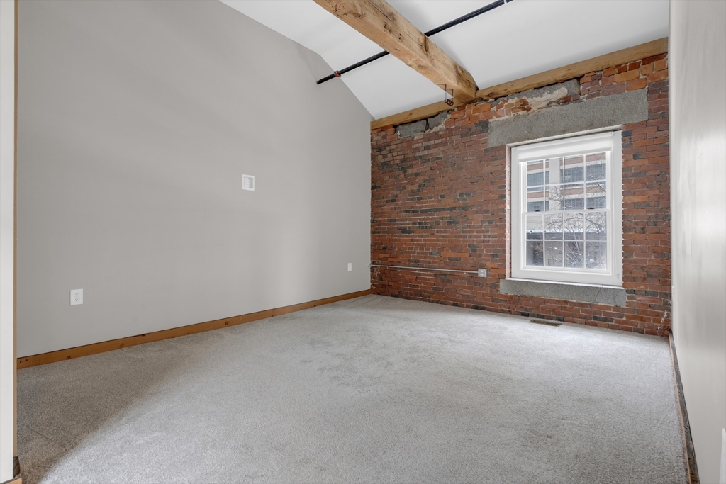 58 13th Street, Unit T105 Boston, MA 02129 - Photo 11 of 15 a view of an empty room with a window