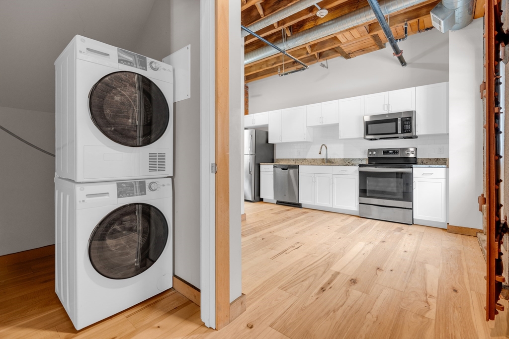 58 13th Street, Unit T105 Boston, MA 02129 - Photo 15 of 15 a view of a kitchen with a washer and dryer