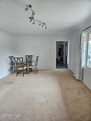 a view of a livingroom with furniture and windows