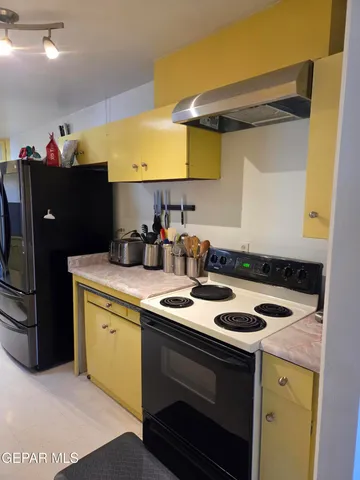 a kitchen with a sink cabinets and appliances