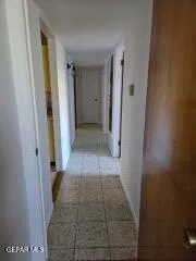 a view of a bathroom with white door