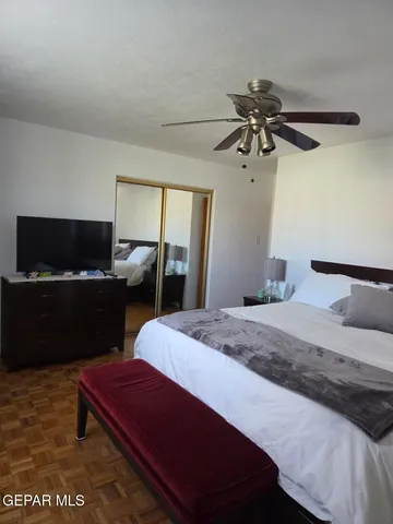 a bedroom with a bed and a dresser