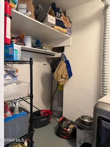 a bathroom with a stove and a refrigerator